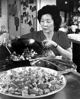 Leeann Chin preparing stir fried food