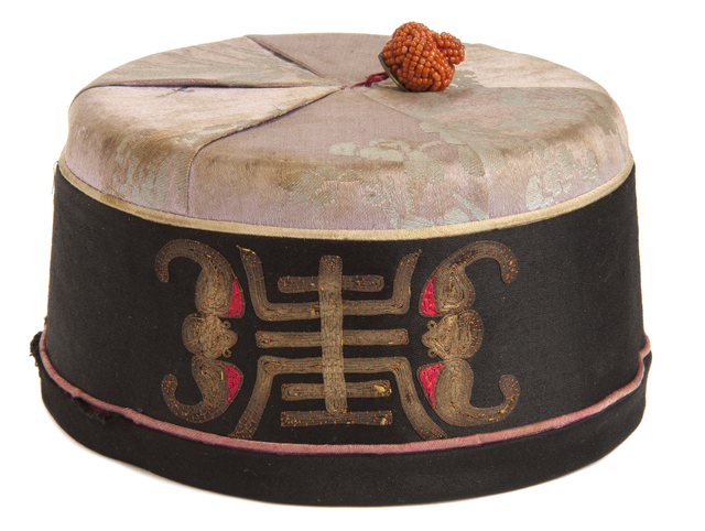 Chinese boy's cap presented to Stanley Chong
